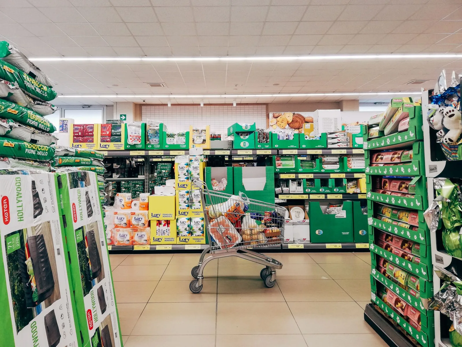 Shopping cart in a supermarket aisle