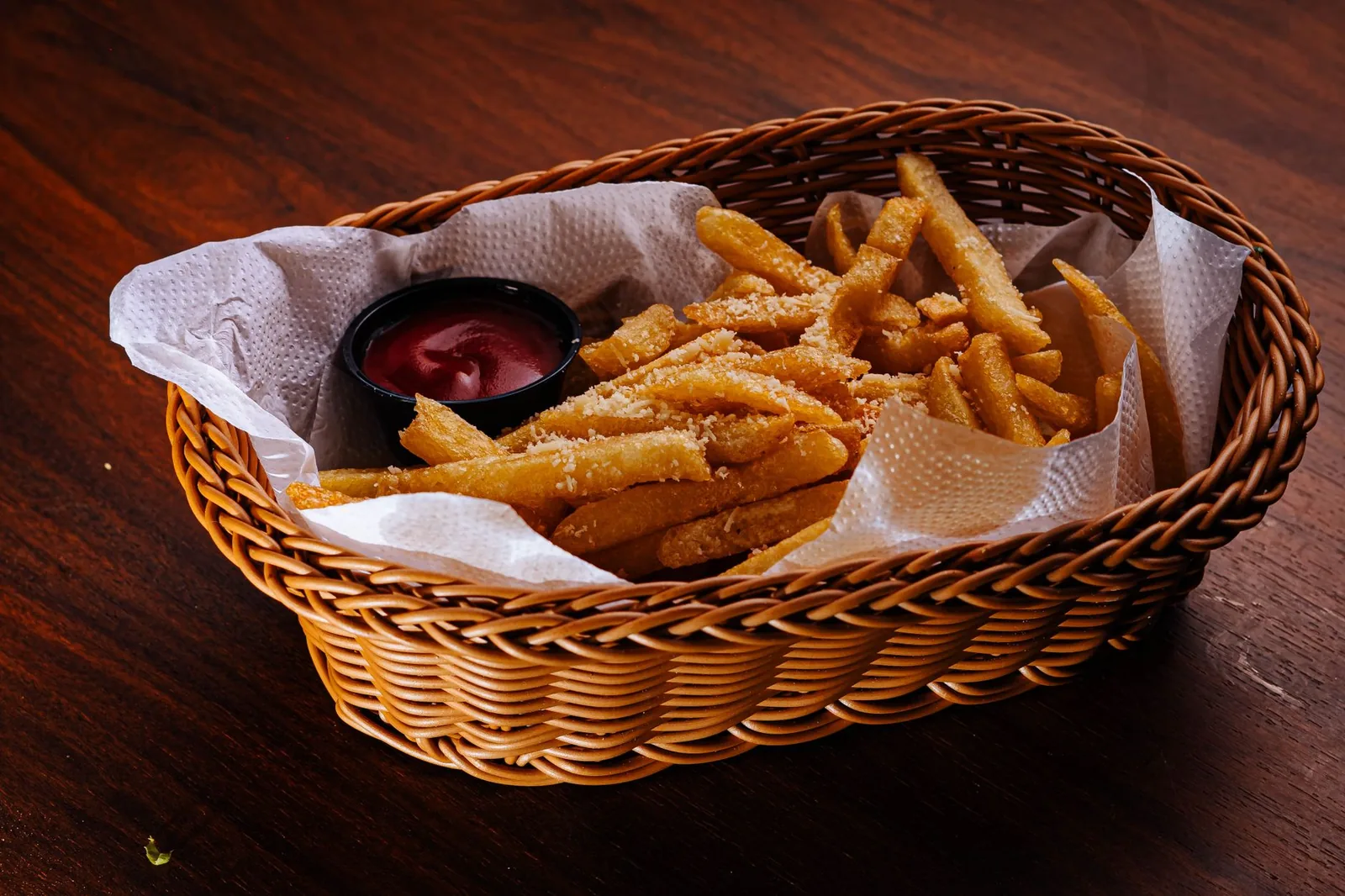 Basket of fries with parmesan and ketchup